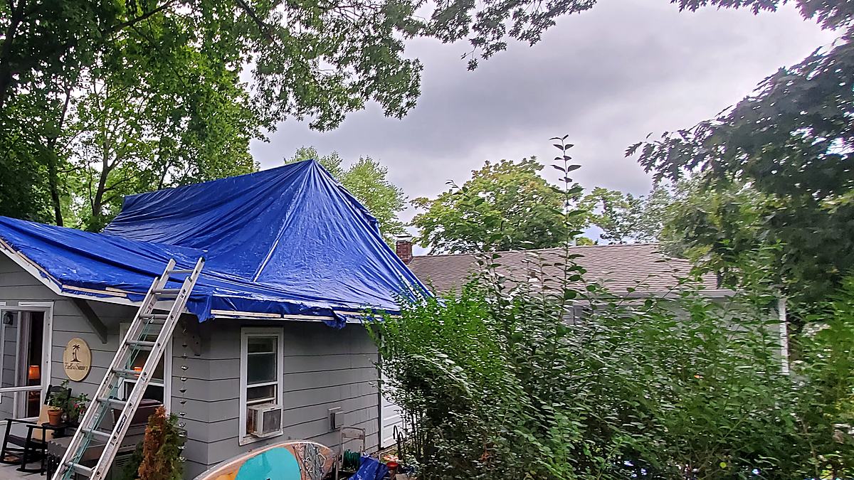 Emergency tarp on a storm-damaged roof in Fairfield County, CT