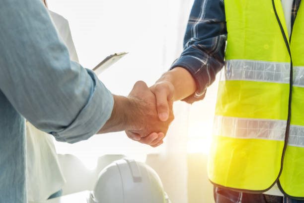 Vascontractors shaking hands with a satisfied client after a home remodeling project in Fairfield County, CT