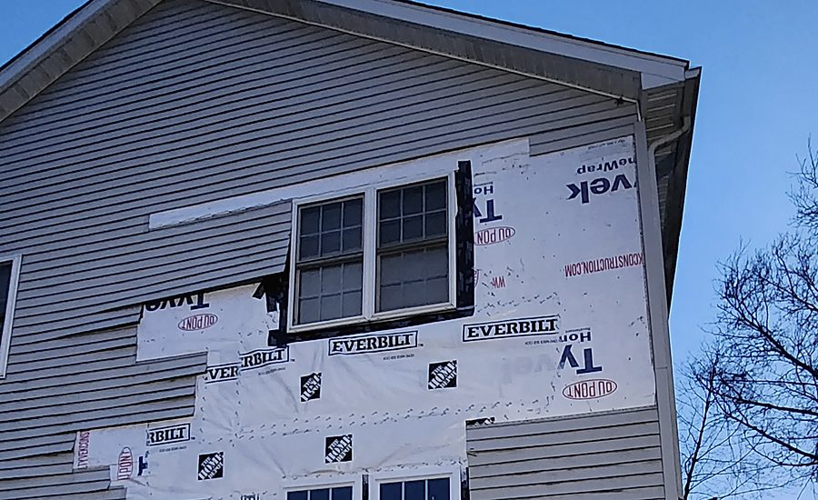 Same wall with the old siding stripped back to the house wrap before new siding was installed