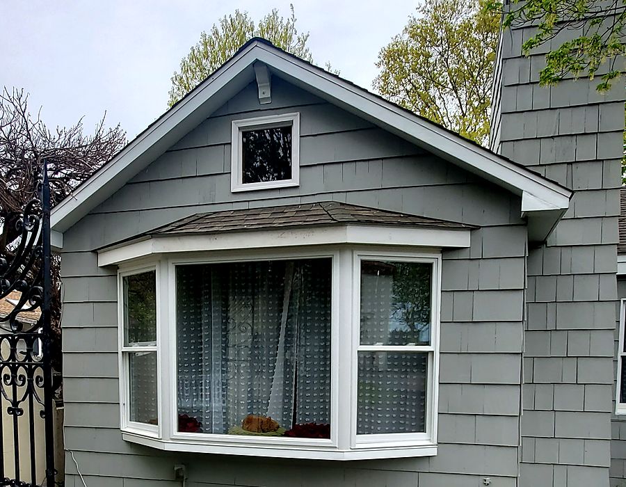 Bay window installed to replace an old bow window on a Fairfield County, CT home, with new trim and flashing